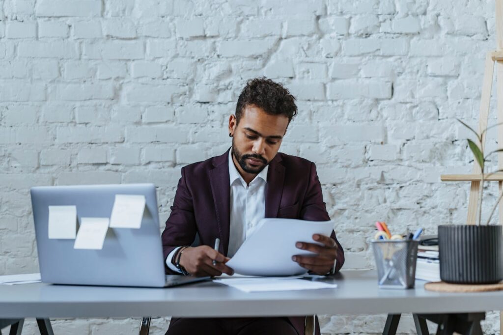 Accountant reviewing client documents during a CDD refresh