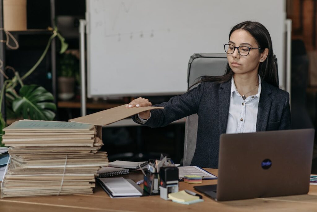 Accountant reviewing client AML records at a desk