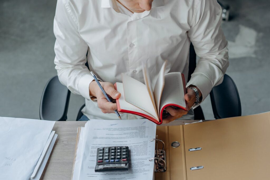 Accountancy professional reviewing client records for an AML materiality assessment