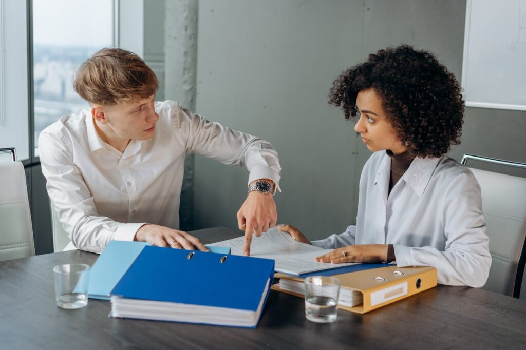 Accountant discussing AML information request with a client during a file review.