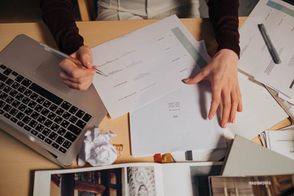 Accountancy professional reviewing client risk assessment records