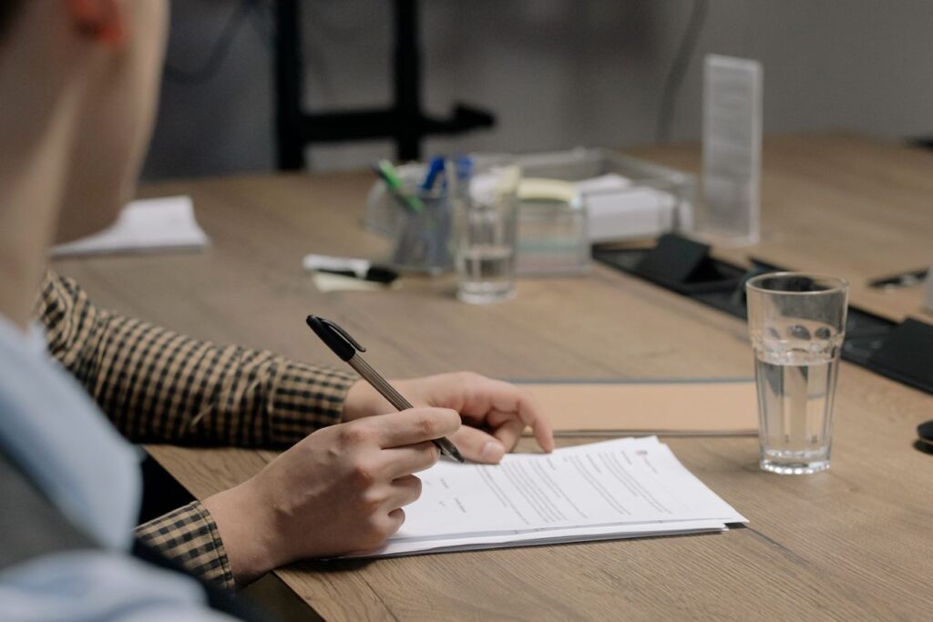 Accountancy firm reviewing client onboarding documents during an AML assessment.