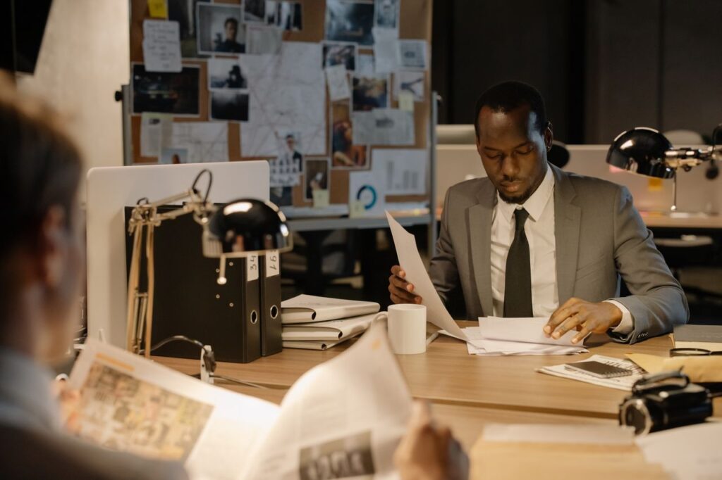 Professional reviewing documents as part of suspicious activity reporting process