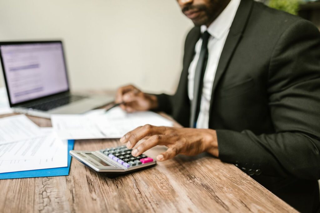 Accountant reviewing financial records as part of UK anti-money laundering compliance